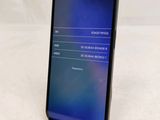the back of a black iphone with a display on it
