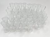 a lot of empty wine glasses sitting on a table