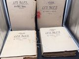 several boxes of books are stacked on top of each other