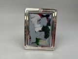 a silver picture frame with a picture of a woman on it