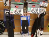 a lot of skis and snowboards on display in a store