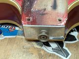 a close up of a skateboard on a wooden floor