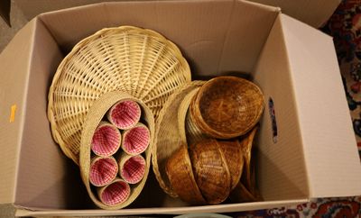 a box with some baskets and bowls inside of it