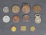 several different coins are arranged in a row on a table