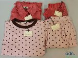 three pairs of pink and red pajamas with polka dots on them