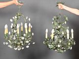 two chandeliers that are hanging from the ceiling