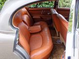 a brown leather seat in the back of a car