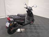 a scooter that is parked in a room