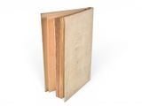 a close up of a book on a white surface with a white background