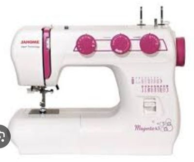 the sewing machine is white and has pink buttons on it