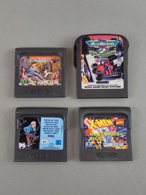 three nintendo games are sitting next to each other on a table