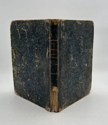 an old book opened to show the inside of it
