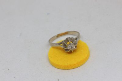 an image of a diamond ring on a yellow sponge