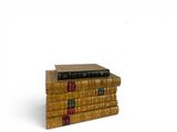 three books stacked on top of each other on a white surface
