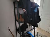 an image of a coat rack in the corner of a room