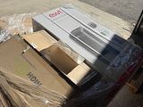 a pile of boxes sitting on the side of the road