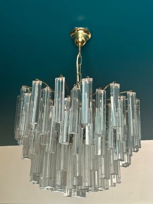 a chandelier hanging from the ceiling in a room