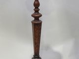 an old wooden table with a wooden top and a wooden base