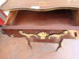 a wooden table with a tray on top of it