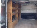 a white van that is parked in a lot