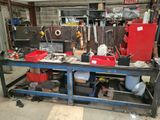a workbench with many tools on it in a garage
