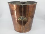 a large copper pot with a handle on a white background
