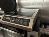 a stove top with a frying pan on top of it