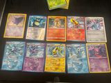 a lot of pokemon cards sitting on a table