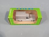 a small toy truck in a box on a table