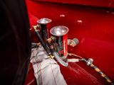a can of soda sitting on the side of a red truck