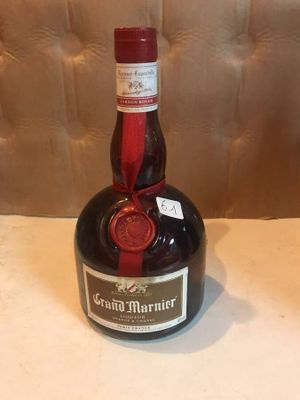 a bottle of brandy sitting on a table