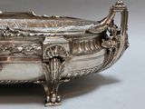 a silver bowl that is sitting on a table