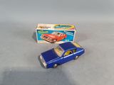 a blue toy car next to a box on a table