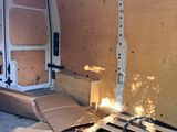 a white van with a wooden pallet in the back of it