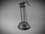 an image of a sculpture of a bird sitting on top of a metal object