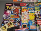 a lot of pokemon comics on the table