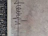 an old photo of a person ' s handwritten signature on a piece of paper