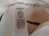 a close up of a label on a white shirt