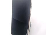 a cell phone that is sitting on top of a stand
