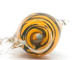 a yellow and black striped glass bead on a silver chain
