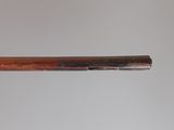 a close up of a baseball bat with a wooden handle