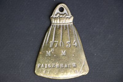 a small metal object that is on a black surface