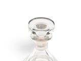 a clear glass bottle with a stopper on it