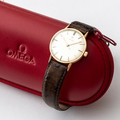 a watch sitting on top of a red case