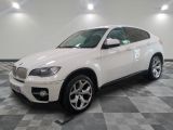 a picture of a white bmw suv on a checkered floor