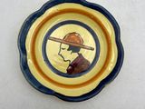 a plate with a picture of a man with a hat on it