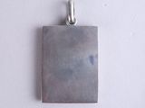 sterling silver square pendant with a textured surface