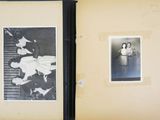 an old black and white photo of a couple of people in a room