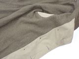 a close up of a piece of cloth with holes in it