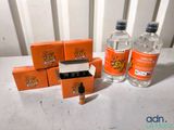 several bottles of water and a box of cigarettes on a table